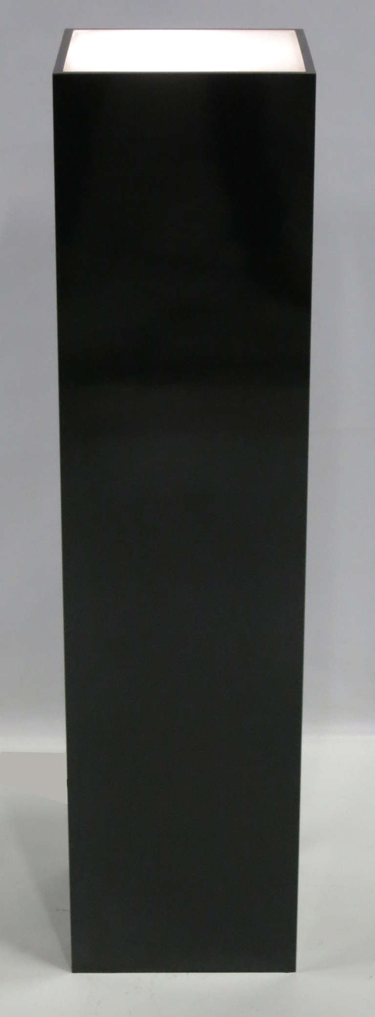 Black Laminate pedestal with interior uplighting.  
