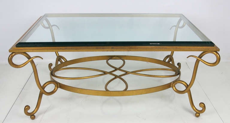 Wrought iron Coffee table with thick beveled glass top in the style of Rene Drouet.  