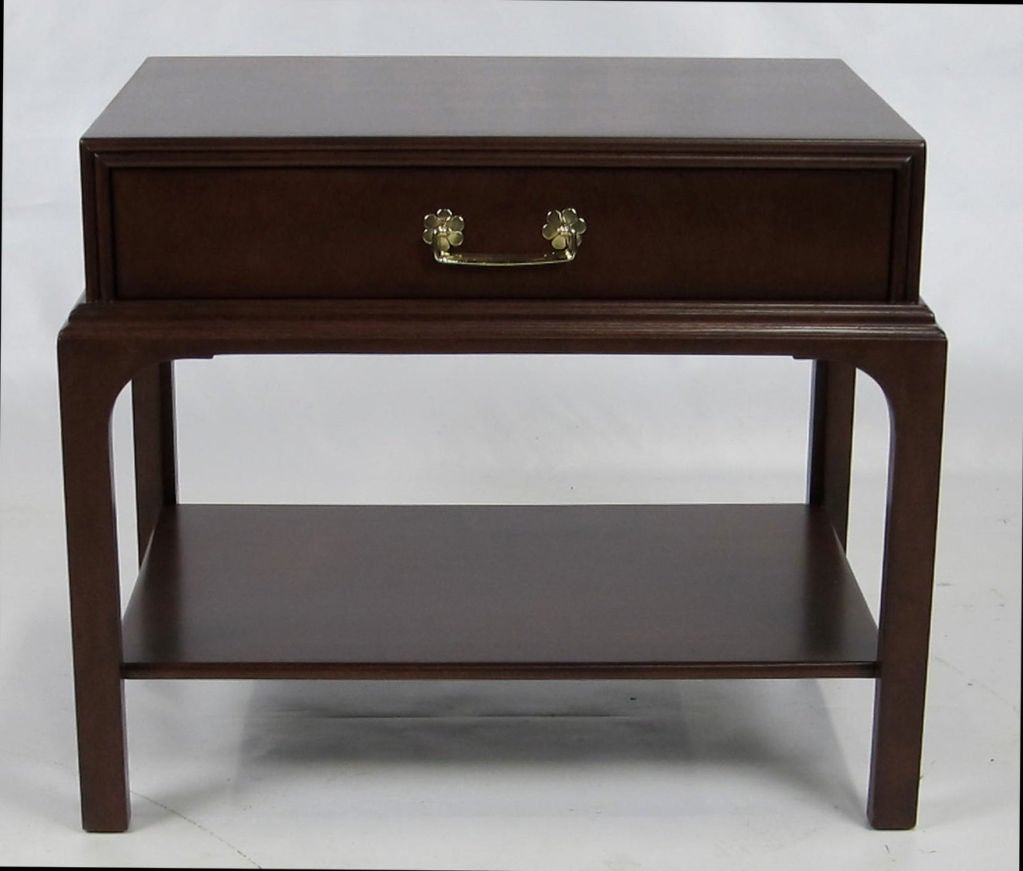 Lovely Side Table or Nightstand with undershelf by Kittinger.  The piece has a distinct box-on-stand design reminiscent of similar pieces by Tommi Parzinger.  Refinished in dark Walnut lacquer.