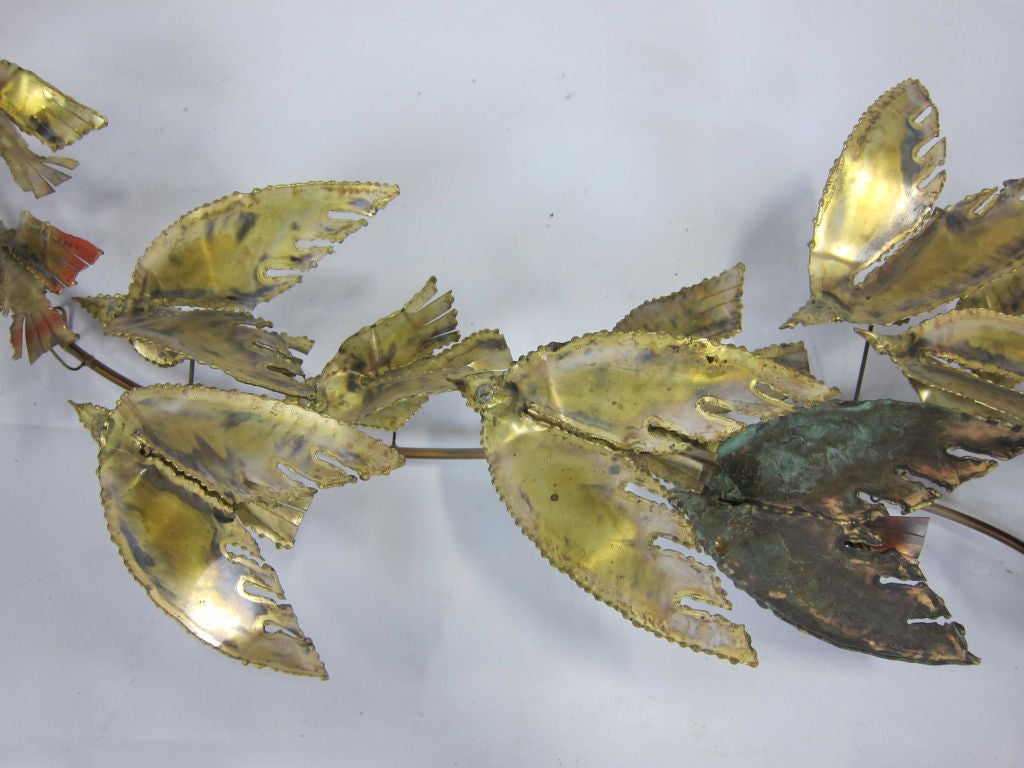 Patinated flock of birds in flight by C. Jere.