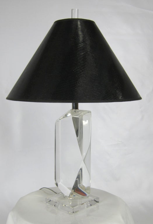 Glamorous randomly faceted thick Lucite table lamp in the style of Karl Springer.  The original shade is glossy black embossed lizard parchment