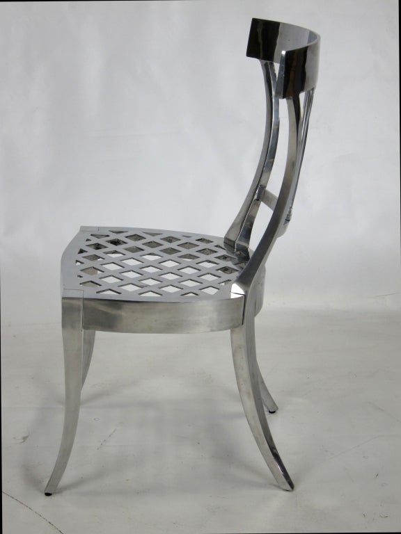 Solid cast Polished Aluminum Klismos Chair.  Heavy and beautifully crafted item.