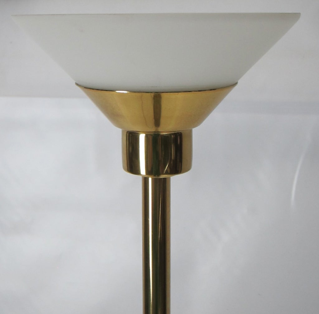 70's design Brass Torchere with frosted glass shades by Koch & Lowy.  The light source is a single, dimmable halogen bulb.