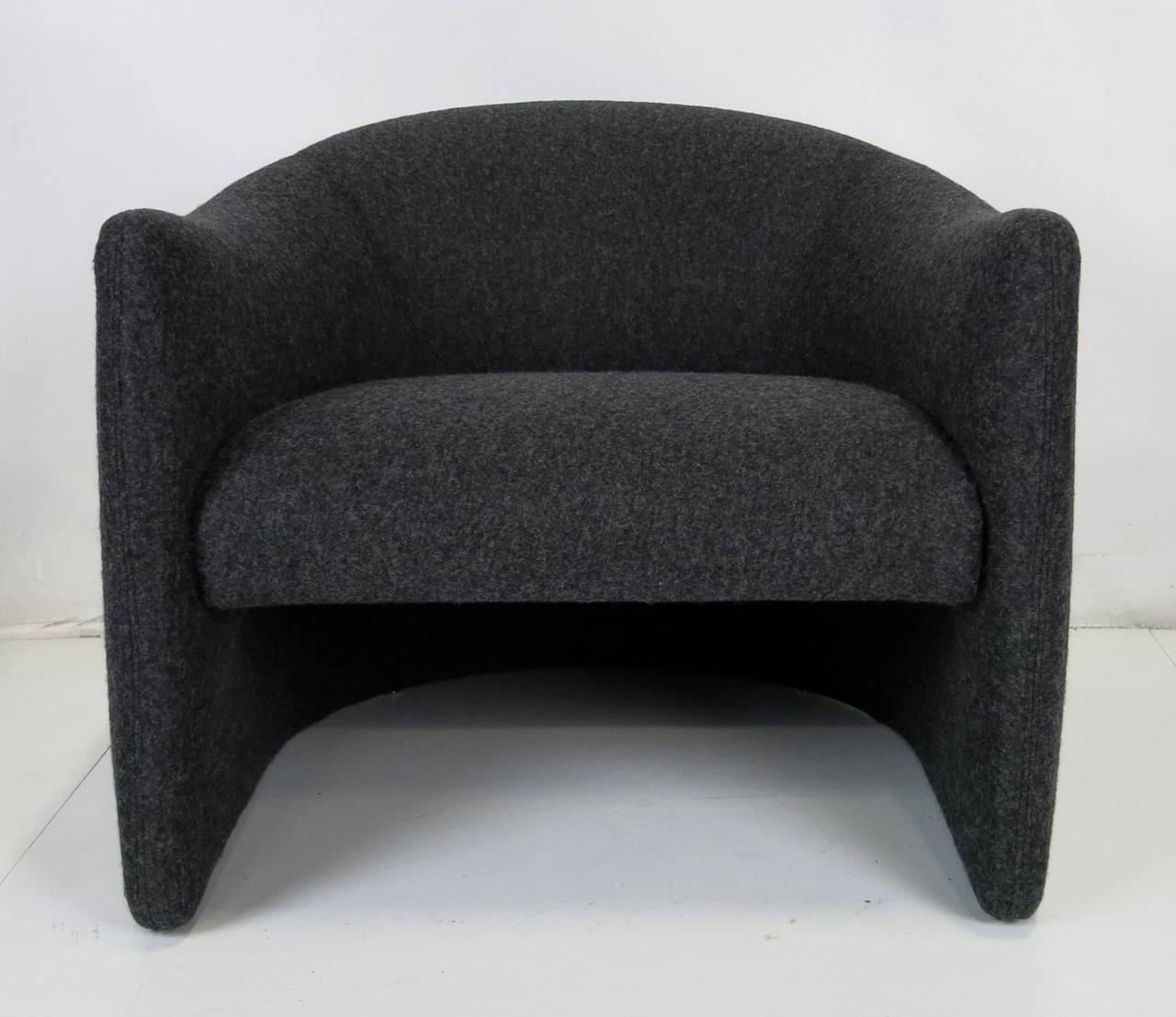 Pair of Sculptural Modern Lounge Chairs freshly upholstered in heavy weight 100% Wool/Cashmere suiting flannel.  These chairs are amply scaled and dangerously comfortable....a super stylish pair.  