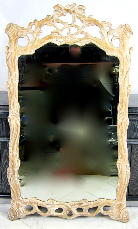 Beautifully hand carved Faux Bois Mirror with Foliate pediment, Cerused finish.  Please browse our entire inventory at www.antiquesdumonde.1stdibs.com