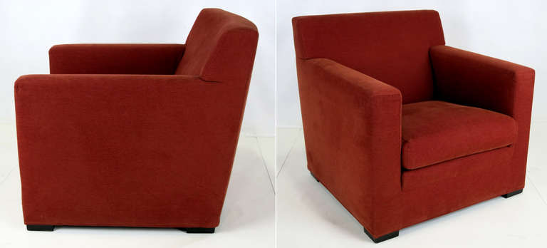 Handsome pair of Club Chairs by Rodolfo Dordoni for Minotti, Italy.  Raised on wooden block feet.