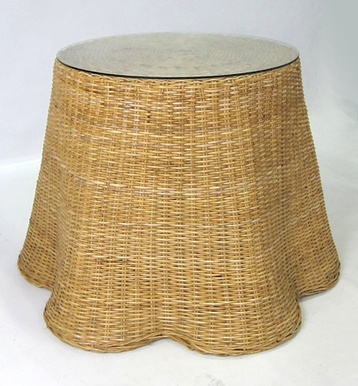 Beautifully crafted Wicker table with wavy drape-like skirt. Please browse our entire inventory at www.antiquesdumonde.1stdibs.com
 
Top diameter- 30