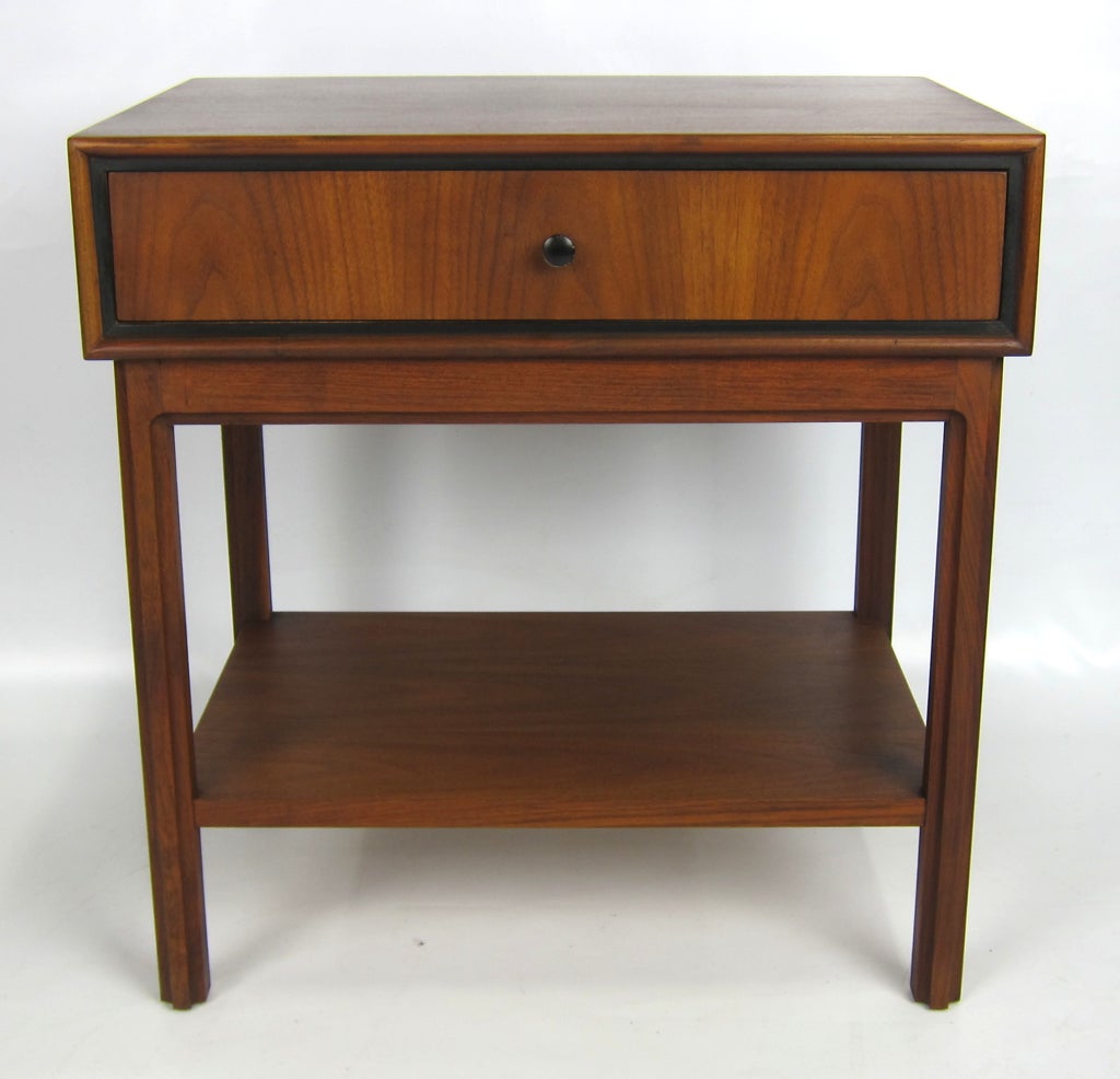 Beautifully crafted pair of Walnut Night Stands with black enamel trim by Milo Baughman for Arch Gordon.  Refinished in original deep Walnut color.