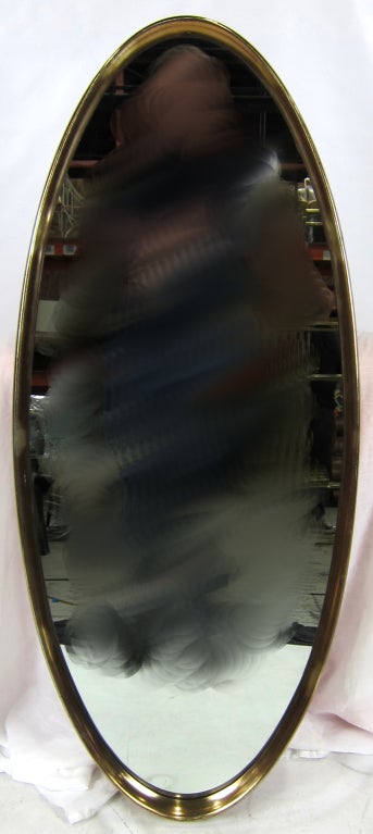 Large Oblique Oval Gilt Mirror in a deep set frame.