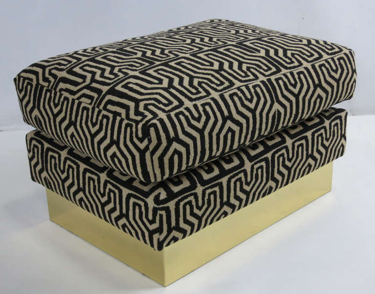 Pair of woven tribal motif ottomans raised on brass bases.