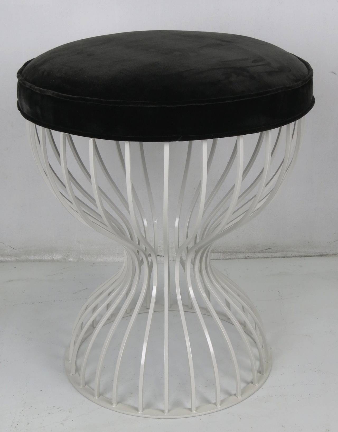 Steel hourglass cage form vanity or task stool with luxurious velvet seat. The base can be lacquered to spec and the seat can also be upholstered in com. We have two of the bases available to be finished as desired.