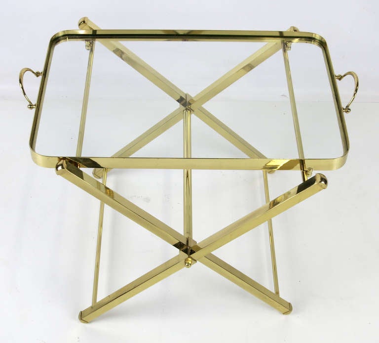 Polished Brass Tray table with removable Tray with inset glass top.  The table folds up for storage.