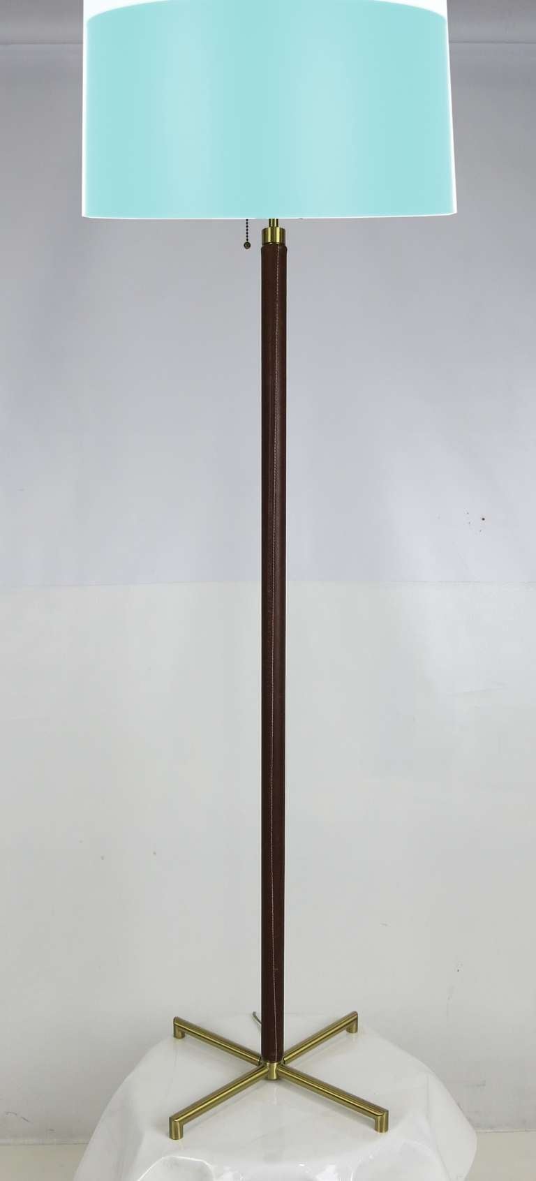 Handsome solid brushed brass floor lamp with stitched leather wrapped neck by Shelton-Mindel for Nessen Lighting.