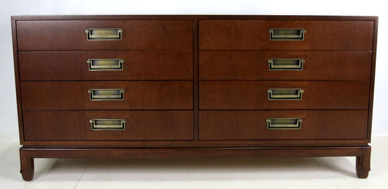 Gorgeous Walnut Cabinet with Mahogany drawer fronts and brass Modern Campaign style pulls.  Base with stylized 