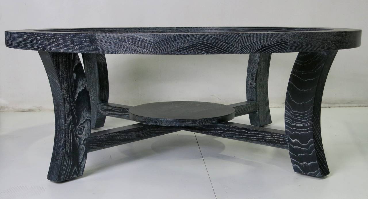Classic Modern coffee table by Paul Frankl of ebonized and cerused oak. The table has a stepped inner circumference that can support a round glass top at any desired level or height.