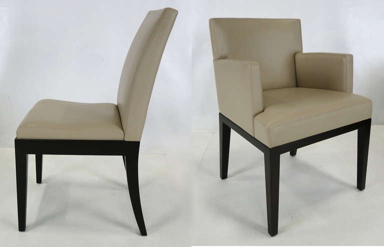 Set of Six Dining Chairs in Wenge finish with Oyster Leather upholstery by Christian Liaigre for Holly Hunt.  These luxurious chairs are in virtually new condition.  

Dimensions-  

Arm Chairs- 22.5 x 24 x 32.5, 19

Side Chairs- 17.5 x 22 x