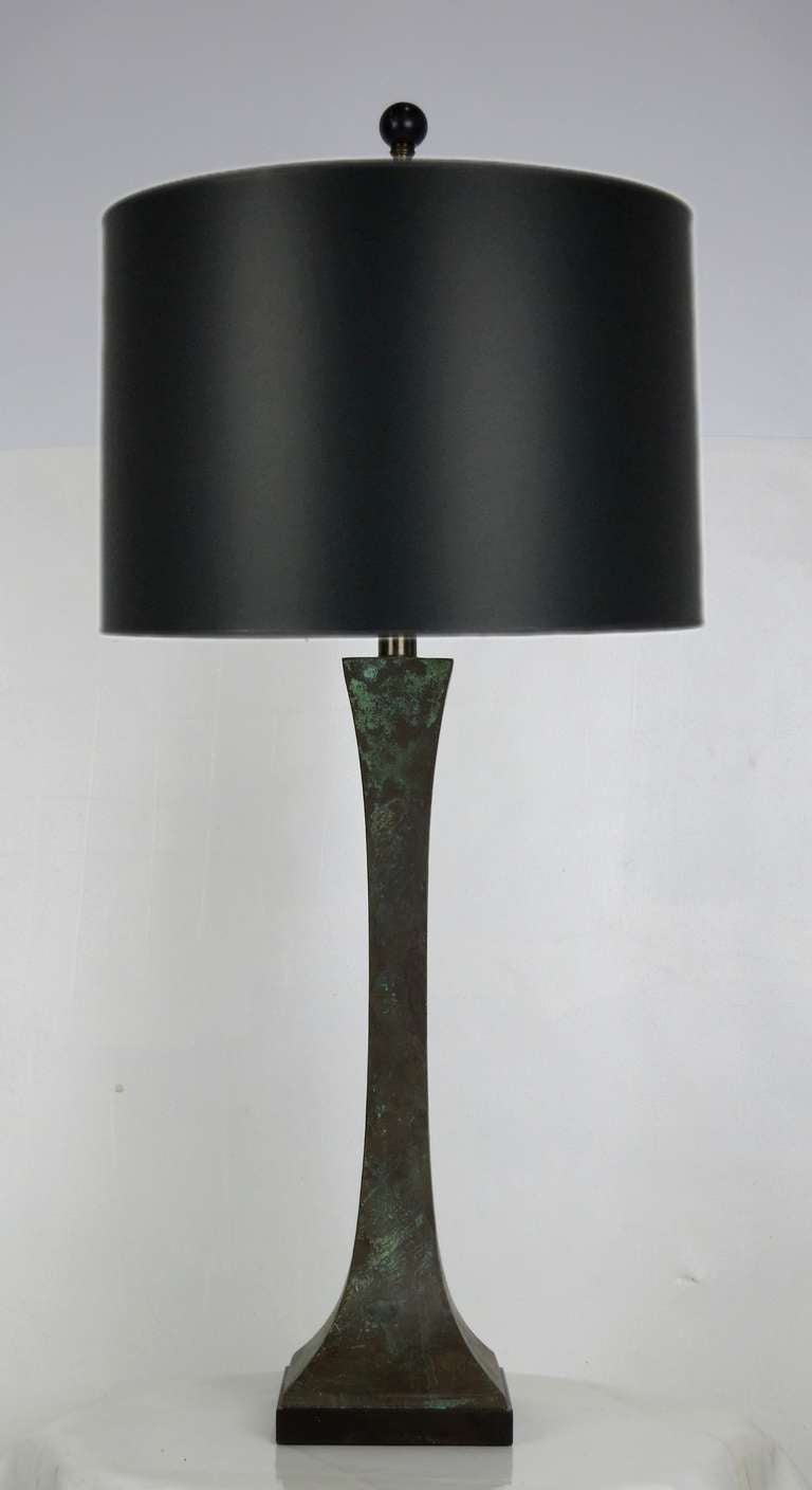 Fantastic Pair of Sculpted Bronze Table lamps on Ebonized wood bases.  Shades are for display only and are not included.