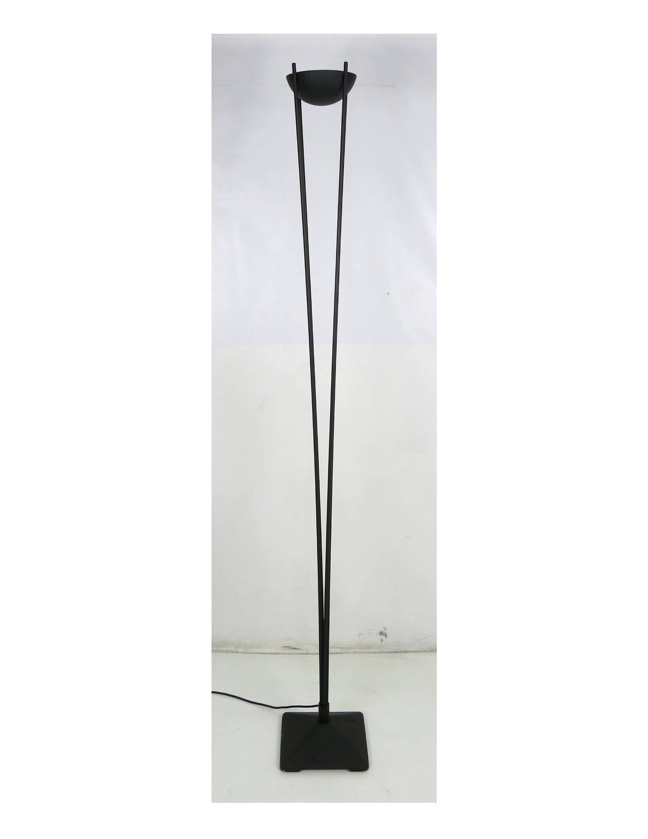 Pair of Classic modern torchieres with a half spherical shade supporting by four flaring supports. The dimmer/floor switch controls a 100W halogen bulb. 

Dimensions-
Base- 10