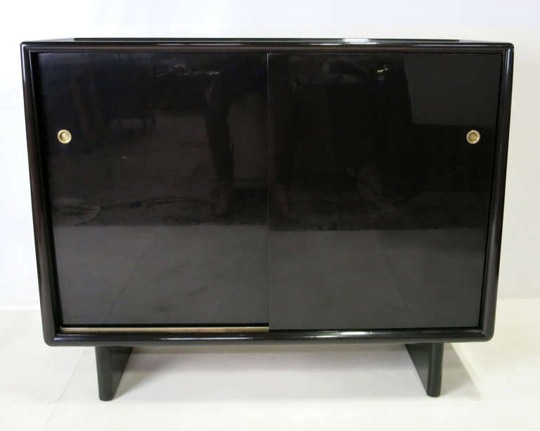 Spectacular Cabinet with fitted interior by T.H. Robsjohn-Gibbings for Widdicomb.  The piece has been meticulously polished to a mirror-like French Polished Espresso Lacquer finish.  This chest should not be confused with the earlier (pre)