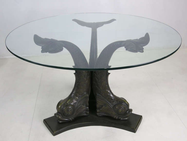 Fabulous patinated bronze Tripartite Dining Table with beautifully detailed Venetian Dolphin supports.  The glass top rests on the fins.  Table is shown in the photos with a 42