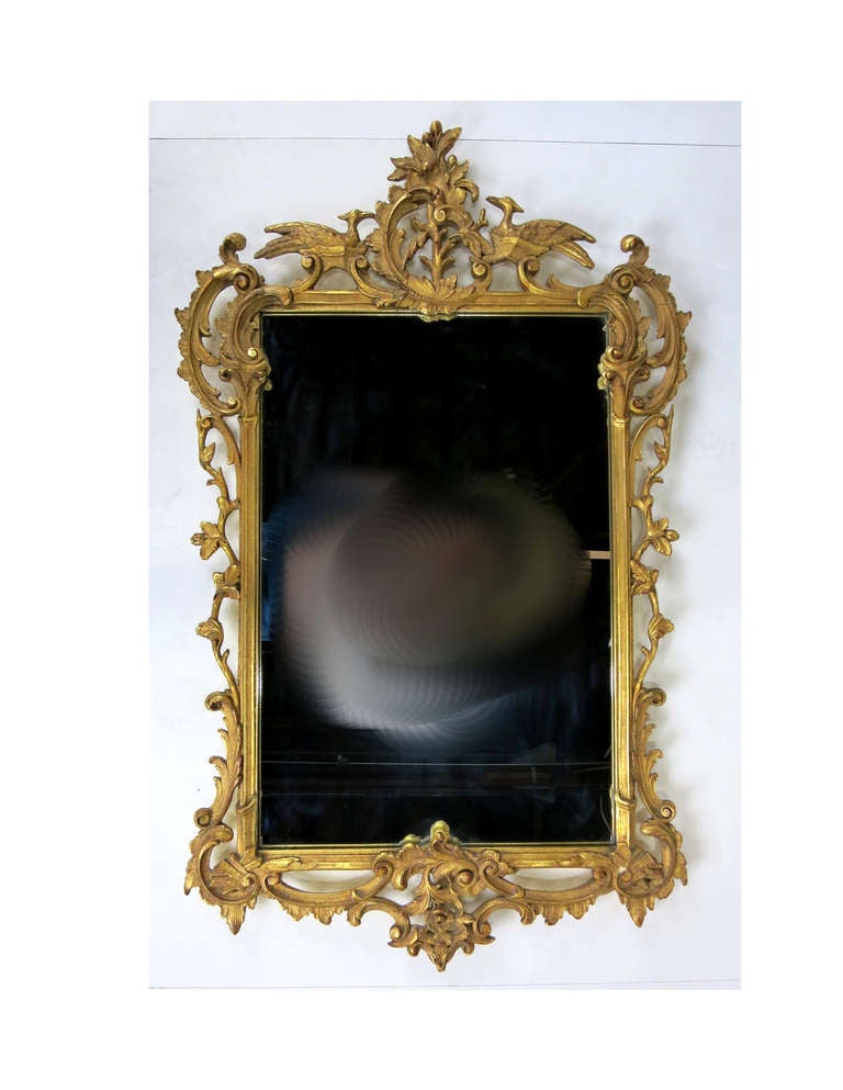 Finely carved gilt wood mirror by the renowned Milch Bros. of New York.  Paper label-