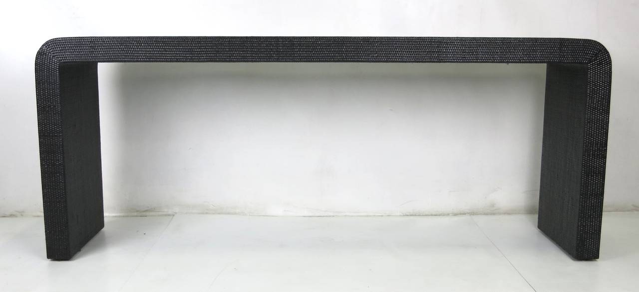 Large-scale lacquered raffia console table. Freshly restored. We can custom paint the piece to specification on order.