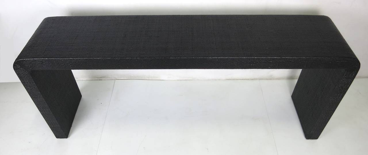 black waterfall console table