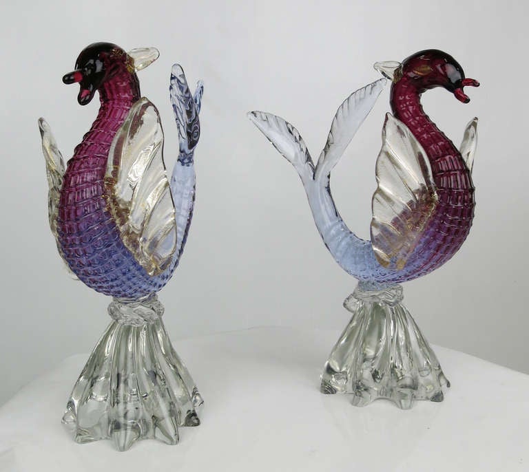 Rare and beautifully rendered Murano Glass Sea Horse or Hippocampus by Alfredo Barbini.  The Dragon form body fades from Aubergine to blue with Cordonato d'Oro eyes and wings raised on a clear fluted wave form base.
Please call or use the 