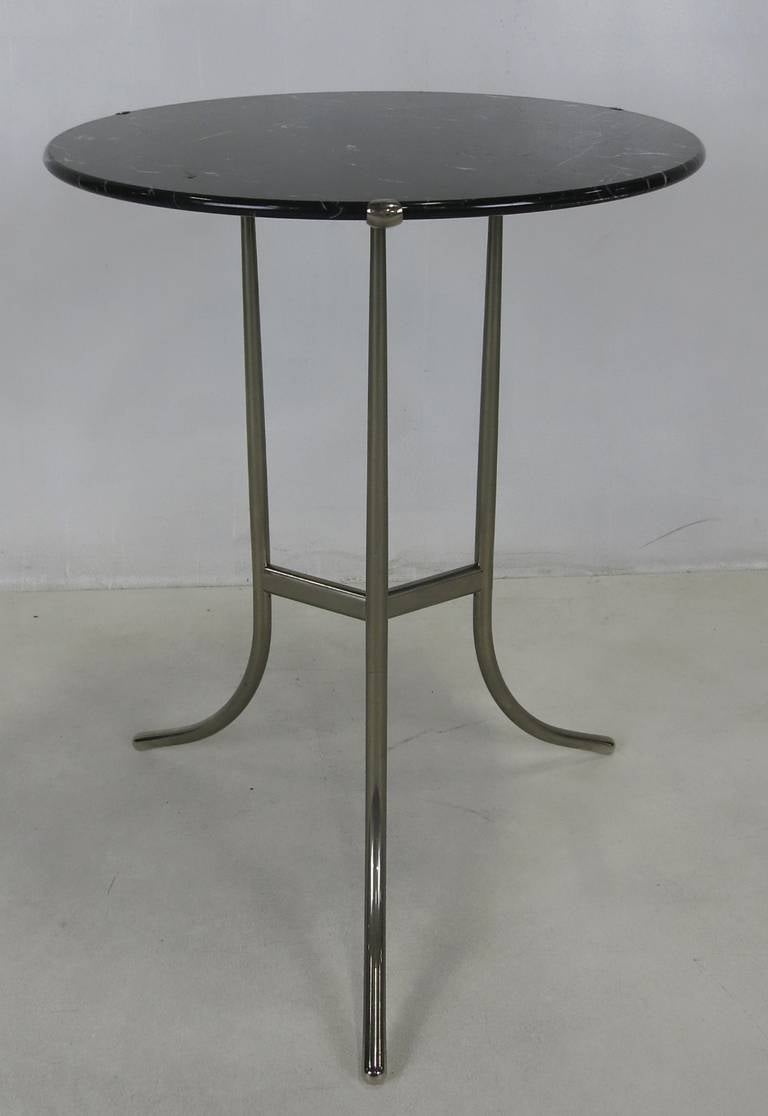 Classic pair of AE side tables in our favorite materials;  black Nero Marquina marble on the polished nickel base.  The pair are in beautiful original condition.