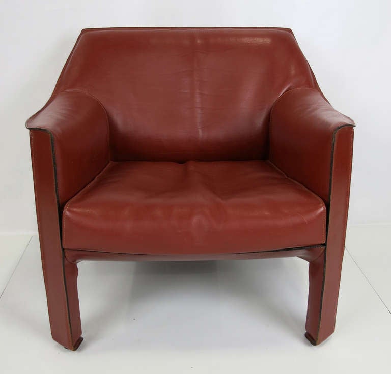 CAB 415 Lounge Chair in Russian Red by Mario Bellini for Cappellini.  Please contact us directly by email or phone for best price and shipping quote from our network of insured blanket wrap shippers