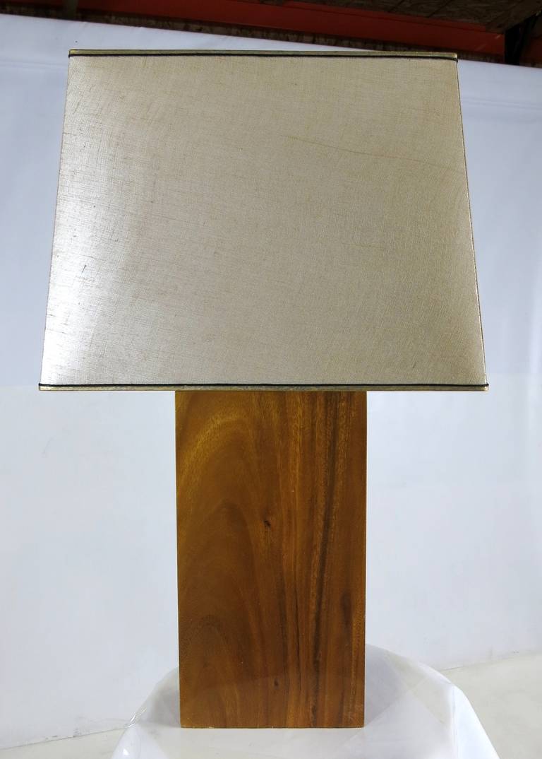 Dramatic solid koa wood table lamp with its original iridescent Grasscloth shade. 

Base: 4 x 10 x 22 to socket.

Shade:
 20 x 14 bottom.
17 x 12 top.
15 high.