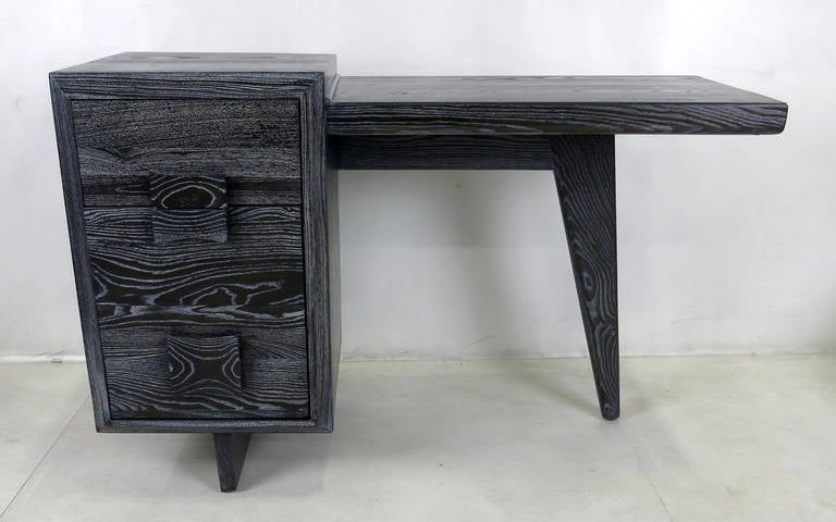 Bi-level writing desk in vividly grained ebonized and cerused oak. The piece has been completely restored and refinished. 

Writing surface is 28.75