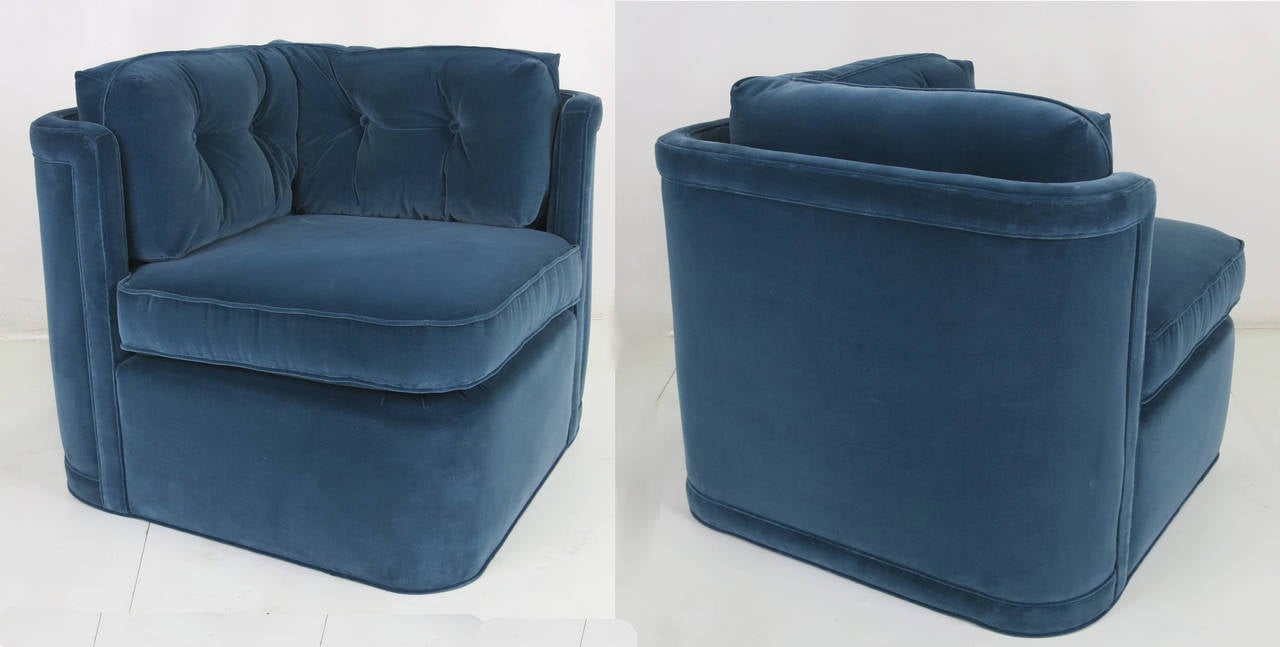 Pair of super comfortable velvet corner lounge chairs beautifully restored and reupholstered in luxurious heavyweight sea blue velvet. This versatile pair can be arranged in several configurations; side by side like a loveseat, opposing like a