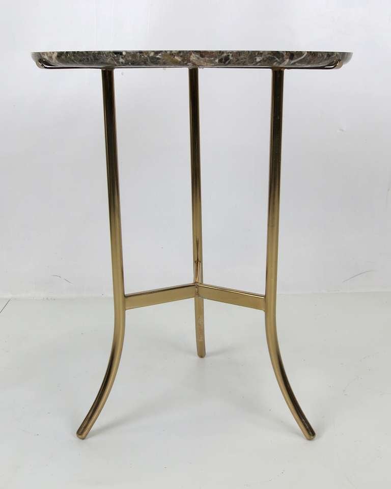 Brass table with granite top in the style of Cedric Hartman.