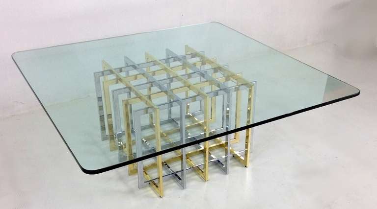 Sculptural Coffee Table consisting of interlocking chrome and brass elements.  The piece is in exceptionally good original condition and will support up to a 48" square top