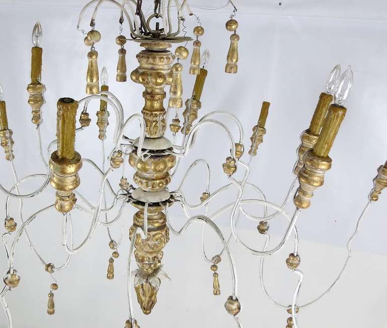 Late 20th Century Huge Italian Iron and Carved Parcel Gilt Wood Chandelier