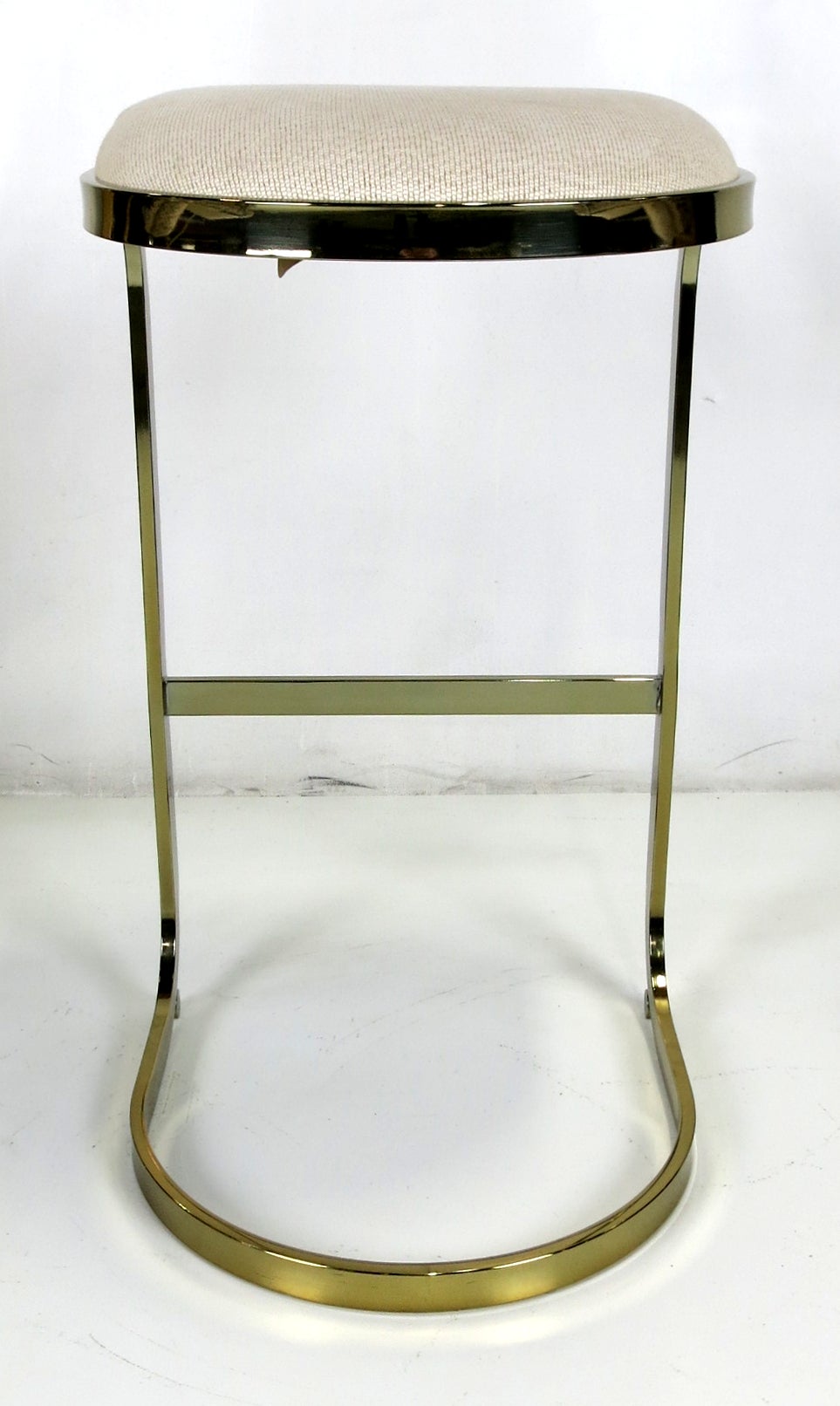 Upholstery Pair of Cantilevered Brass Barstools