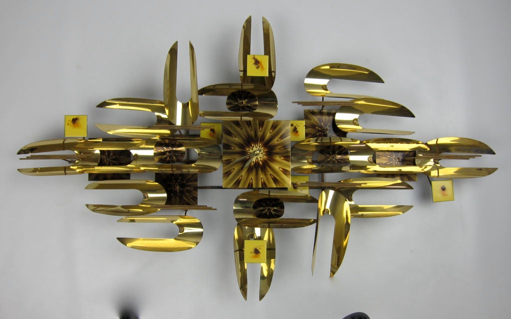 Large Wall Sculpture Clock in the style of Jere.  The sculpture includes Brass and Enameled brass elements.  Can be hung both vertically or horizontally.