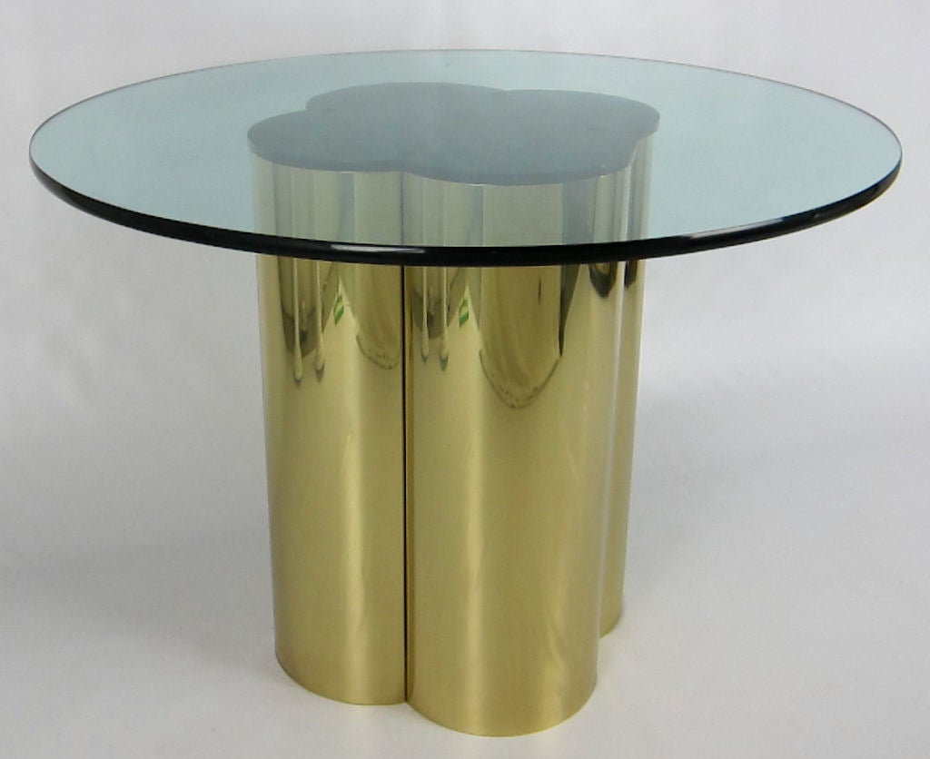 Superb brass Quatrefoil Games or Breakfast table by Mastercraft.  The heavy brass base is topped with a matching black acrylic top, which holds the glass top.  Table is shown with a 42