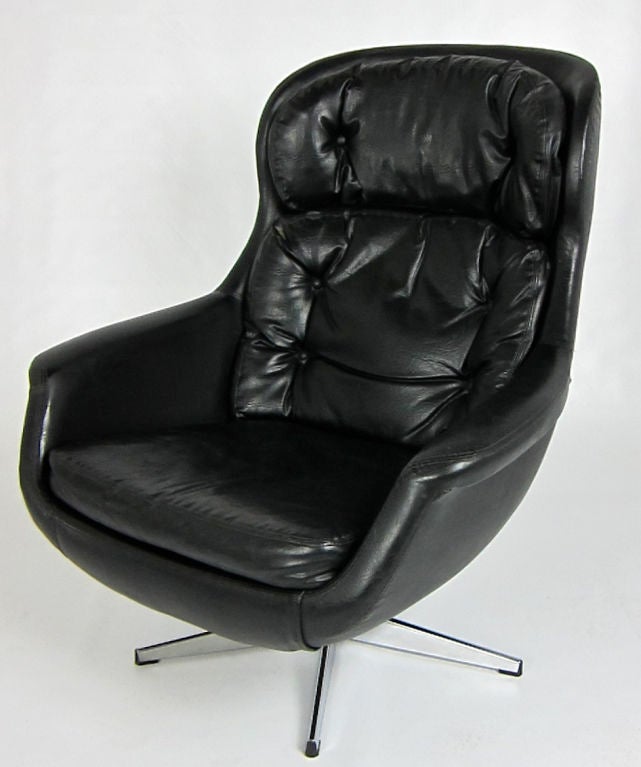 Mid Century Rocking and Reclining Egg style Lounge Chair in Black Leatherette by Selig.  Chrome base.