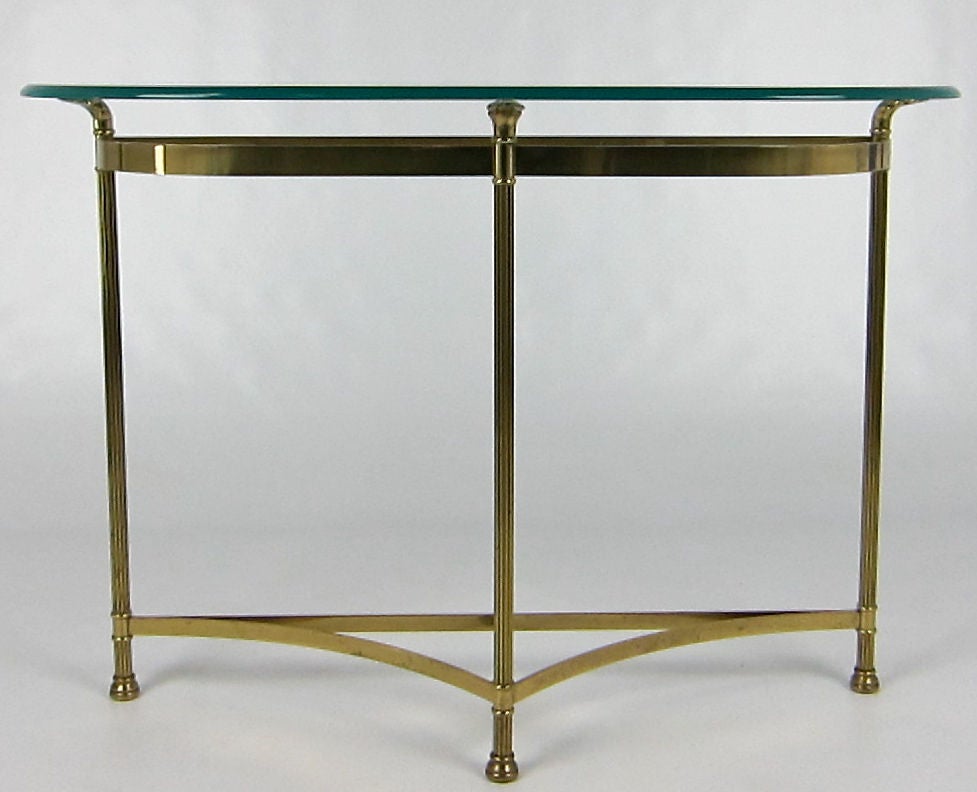 Classic LaBarge solid Brass Demilune console with reeded supports and bun feet. Profile edge glass top is raised on palm leaf supports.  Labeled, 