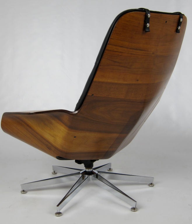 Meticulously restored Ultra Modern Walnut Shell Lounge Chair and Ottoman by George Mulhauser for Plycraft.  The shell has been refinished and the upholstery has been replaced with black Italian glove leather.  The rarely seen chrome star base is