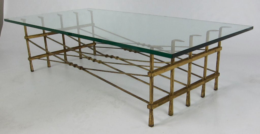 Large Scale Gilt Iron Coffee Table with bent arrow form supports and trussed cross stretchers.  1