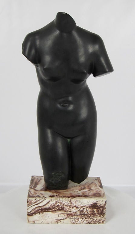 Black glazed Ceramic Torso of Aphrodite on Calacatta Marble base by Alva Studios.  Labeled as a copyrighted reproduction from the Museum of Modern Art, NY.