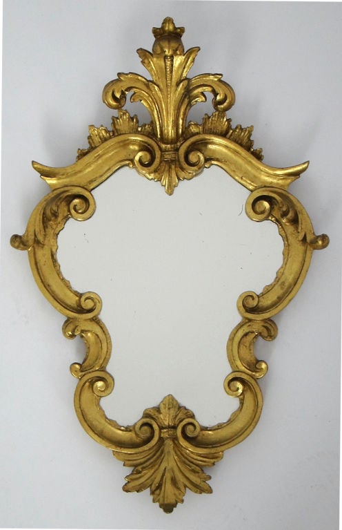 Beautifully carved and gilt pair of Italian Wall Mirrors.