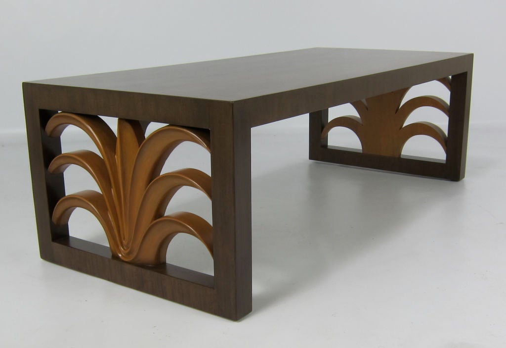 Modernist form Coffee table with carved Plume ornaments by Robsjohn-Gibbings for Widdicomb.  The piece has been meticulously restored in Dark Walnut lacquer with the Plume carving bleached and lacquered.