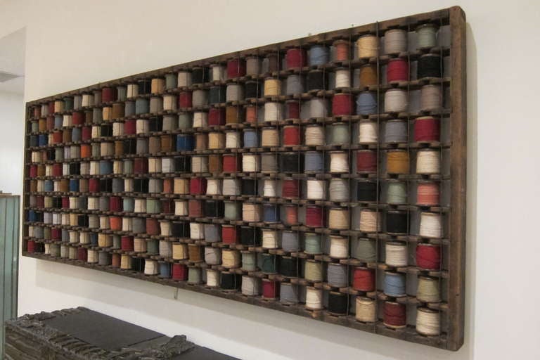 French, early 20th century industrial wood rack for 260 wool yarn bobbins. From a textile mill in France. All original.

THIS ITEM IS LOCATED IN MANHATTAN AT 1STDIBS@NYDC SHOWROOM. 
200 LEXINGTON AVE - 10TH FLOOR, NYC