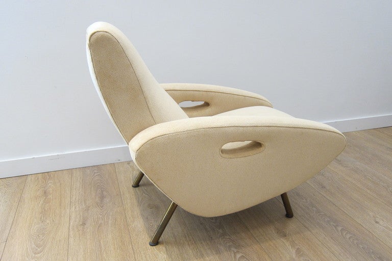 Rare 1950's lounge chairs by Maurice Mourra, newly upholstered. Tubular brass legs.