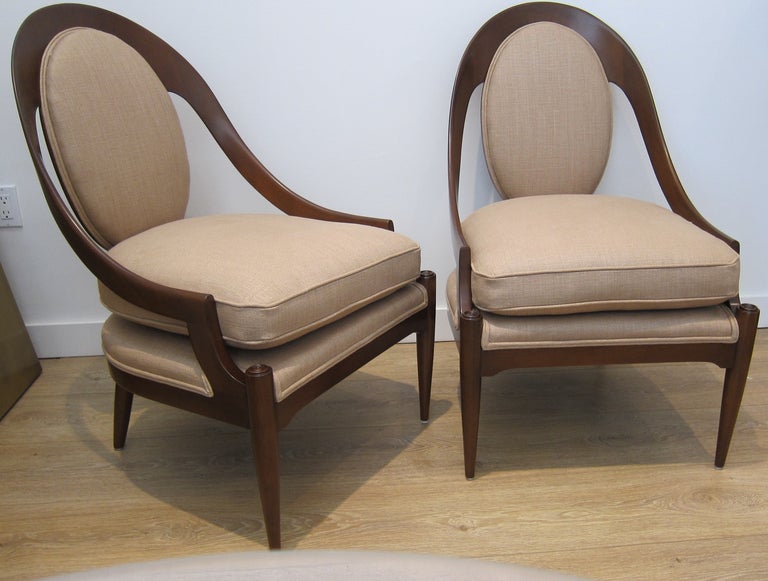 Superb pair of spoon back lounge chairs, Walnut frame, newly refinished and upholstred with raw silk.