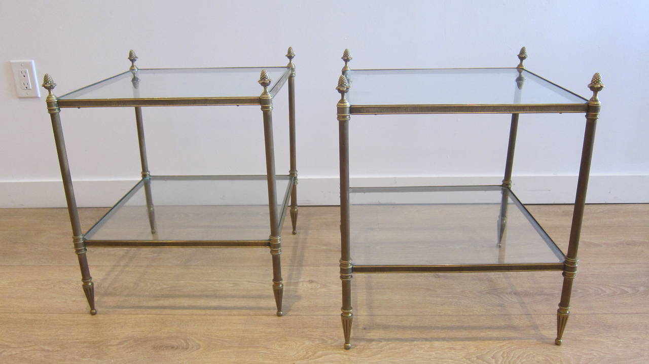 1940s pair of French two-tier brass end tables, with clear inset glass top.
Superb details and craftsmanship.